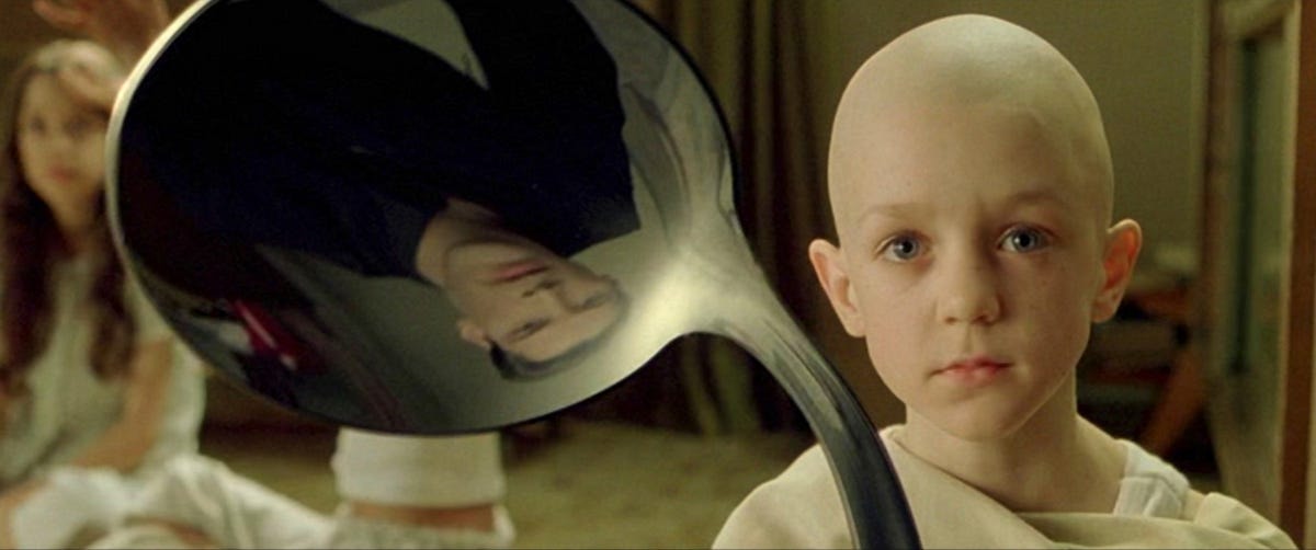 A picture from the film The Matrix when Neo encounter the boy bending a spoon. 